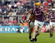 12 September 2004; Martin Ryan, Galway, in action against Patrick Hogan, Kilkenny. All-Ireland Minor Hurling Championship Final, Galway v Kilkenny, Croke Park, Dublin. Picture credit; Damien Eagers / SPORTSFILE *** Local Caption *** Any photograph taken by SPORTSFILE during, or in connection with, the 2004 Guinness All-Ireland Hurling Final which displays GAA logos or contains an image or part of an image of any GAA intellectual property, or, which contains images of a GAA player/players in their playing uniforms, may only be used for editorial and non-advertising purposes.  Use of photographs for advertising, as posters or for purchase separately is strictly prohibited unless prior written approval has been obtained from the Gaelic Athletic Association.