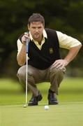 17 September 2004; Martin O'Toole, Lucan Golf Club, lines up his putt on the 18th. Bulmers Junior Cup Final, Lucan v Portstewart, Shannon Golf Club, Shannon, Co. Clare. Picture credit; Ray McManus / SPORTSFILE