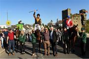 9 April 2025; Patrick Mullins on Nick Rackett celebrates with, from left, Danny Mullins on I Am Maximus, groom Katie Walton, owner Stewart Andrew, champion trainer Willie Mullins, and Brian Hayes on Gramgeclare, as they are welcomed home to Carlow during homecoming celebrations at the Lord Bagenal Inn in Leighlinbridge following their Grand National win. Photo by Matt Browne/Sportsfile
