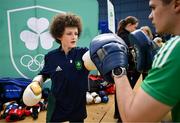 10 April 2025; Olympic athletes Kellie Harrington and Philip Doyle, along with Paralympian Orla Comerford, who are all Dare to Believe ambassadors, attended the Dare to Believe booth at PE Expo 2025, sponsored by Allianz, at the Sport Ireland National Indoor Arena in Dublin. Pictured at the Dare to Believe PE Expo 2025 is Jack Frehill hitting pads held by boxer Adam Hession. Photo by David Fitzgerald/Sportsfile