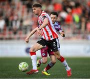 11 April 2025; Ronan Boyce of Derry City in action against Darragh Markey of Drogheda United during the SSE Airtricity Men's Premier Division match between Derry City and Drogheda United at The Ryan McBride Brandywell Stadium in Derry. Photo by Stephen McCarthy/Sportsfile