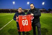 11 April 2025; Shelbourne kitman Johnny Watson, left, is presented with a Shelbourne jersey to mark his 60th birthday by Shelbourne co-owner Neil Doyle, during the half-time interval in the SSE Airtricity Men's Premier Division match between Shelbourne and Bohemians at Tolka Park in Dublin. Photo by Ben McShane/Sportsfile