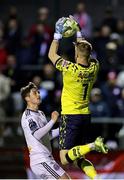 11 April 2025; Shelbourne goalkeeper Conor Kearns makes a save as Colm Whelan of Bohemians watches on during the SSE Airtricity Men's Premier Division match between Shelbourne and Bohemians at Tolka Park in Dublin. Photo by Thomas Flinkow/Sportsfile