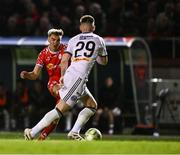 11 April 2025; Sean Boyd of Shelbourne has a shot on goal despite the efforts of Sean Grehan of Bohemians during the SSE Airtricity Men's Premier Division match between Shelbourne and Bohemians at Tolka Park in Dublin. Photo by Ben McShane/Sportsfile
