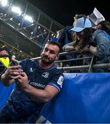 11 April 2025; Rónan Kelleher of Leinster takes selfies with supporters after the Investec Champions Cup quarter-final match between Leinster and Glasgow Warriors at the Aviva Stadium in Dublin. Photo by Brendan Moran/Sportsfile