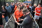 12 April 2025; Armagh supporter Oliver McGirr from Armagh City has his ticket scanned prior to entering before the Ulster GAA Football Senior Championship quarter-final match between Antrim and Armagh at Corrigan Park in Belfast. Photo by David Fitzgerald/Sportsfile