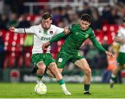 11 April 2025; Kian Leavy of St Patrick's Athletic in action against Evan McLaughlin of Cork City during the SSE Airtricity Men's Premier Division match between Cork City and St Patrick's Athletic at Turner's Cross in Cork. Photo by Michael P Ryan/Sportsfile