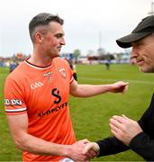 12 April 2025; Connaire Mackin of Armagh with manager Kieran McGeeney after the Ulster GAA Football Senior Championship quarter-final match between Antrim and Armagh at Corrigan Park in Belfast. Photo by David Fitzgerald/Sportsfile