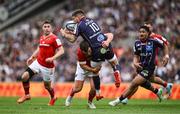 12 April 2025; Matthieu Jalibert of Bordeaux Begles is tackled by Tom Farrell of Munster during the Investec Champions Cup quarter-final match between Bordeaux Begles and Munster at Stade Chaban-Delmas in Bordeaux, France. Photo by Brendan Moran/Sportsfile