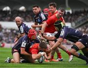 12 April 2025; Alex Nankivell of Munster scores his side's first try despite the tackle of Louis Bielle-Biarrey of Bordeaux Begles during the Investec Champions Cup quarter-final match between Bordeaux Begles and Munster at Stade Chaban-Delmas in Bordeaux, France. Photo by Brendan Moran/Sportsfile