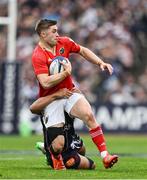 12 April 2025; Jack Crowley of Munster is tackled by Yoram Moefana of Bordeaux Begles during the Investec Champions Cup quarter-final match between Bordeaux Begles and Munster at Stade Chaban-Delmas in Bordeaux, France. Photo by Brendan Moran/Sportsfile