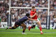 12 April 2025; Jack Crowley of Munster is tackled by Yoram Moefana of Bordeaux Begles during the Investec Champions Cup quarter-final match between Bordeaux Begles and Munster at Stade Chaban-Delmas in Bordeaux, France. Photo by Brendan Moran/Sportsfile