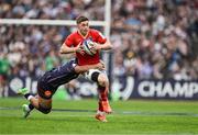 12 April 2025; Jack Crowley of Munster is tackled by Yoram Moefana of Bordeaux Begles during the Investec Champions Cup quarter-final match between Bordeaux Begles and Munster at Stade Chaban-Delmas in Bordeaux, France. Photo by Brendan Moran/Sportsfile