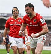 12 April 2025; Andrew Smith of Munster, right, celebrates with teammate Thaakir Abrahams after scoring his side's second try during the Investec Champions Cup quarter-final match between Bordeaux Begles and Munster at Stade Chaban-Delmas in Bordeaux, France. Photo by Brendan Moran/Sportsfile