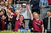 12 April 2025; Sisters Nicola Ward, left, and Louise Ward lift the trophy following the 2025 Lidl Ladies National Football League Division 2 Final between Cork and Galway at Croke Park, Dublin.  during the Lidl Ladies National Football League Division 2 final match between Cork and Galway at Croke Park in Dublin. Photo by Sam Barnes/Sportsfile