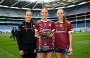 12 April 2025; Sisters Niamh Divilly, Siobhan Divilly and Olivia Divilly with the cup after their side's victory in the Lidl Ladies National Football League Division 2 final match between Cork and Galway at Croke Park in Dublin. Photo by Sam Barnes/Sportsfile
