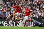 12 April 2025; Alex Nankivell of Munster beats the tackle of Pierre Bochaton of Bordeaux Begles during the Investec Champions Cup quarter-final match between Bordeaux Begles and Munster at Stade Chaban-Delmas in Bordeaux, France. Photo by Brendan Moran/Sportsfile