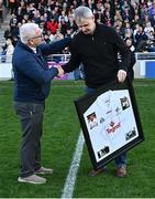 12 April 2025; Kildare GAA Chairman Mick Mullen, left, makes a presentation of behalf of Kildare GAA to the family of the late Mick O'Dwyer and accepted by his son and former Kildare footballer Karl O'Dwyer before the Leinster GAA Football Senior Championship quarter-final match between Kildare and Westmeath at Cedral St Conleth's Park in Newbridge, KiIdare. Photo by Piaras Ó Mídheach/Sportsfile