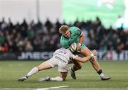 12 April 2025; Hugh Gavin of Connacht is tackled by Sam James of Racing 92 during the EPCR Challenge Cup quarter-final match between Connacht and Racing 92 at Dexcom Stadium in Galway. Photo by Thomas Flinkow/Sportsfile