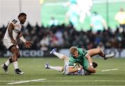 12 April 2025; Hugh Gavin of Connacht is tackled by Sam James of Racing 92 during the EPCR Challenge Cup quarter-final match between Connacht and Racing 92 at Dexcom Stadium in Galway. Photo by Thomas Flinkow/Sportsfile