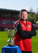 15 April 2025; Ringmahon Rangers FC manager Aidan Foley poses for a portrait with the Pat O'Brien FAI Intermediate Challenge Cup during the FAI Intermediate Cup Final media day at Turners Cross Stadium in Cork ahead of the 2025 FAI Intermediate Cup final match between Ringmahon Rangers FC and College Corinthians FC. Photo by Brendan Moran/Sportsfile