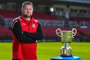 15 April 2025; Ringmahon Rangers FC manager Aidan Foley poses for a portrait with the Pat O'Brien FAI Intermediate Challenge Cup during the FAI Intermediate Cup Final media day at Turners Cross Stadium in Cork ahead of the 2025 FAI Intermediate Cup final match between Ringmahon Rangers FC and College Corinthians FC. Photo by Brendan Moran/Sportsfile