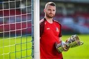 15 April 2025; Ringmahon Rangers FC captain Anthony McAlavey poses for a portrait with the Pat O'Brien FAI Intermediate Challenge Cup during the FAI Intermediate Cup Final media day at Turners Cross Stadium in Cork ahead of the 2025 FAI Intermediate Cup final match between Ringmahon Rangers FC and College Corinthians FC. Photo by Brendan Moran/Sportsfile