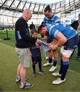 11 April 2025; Leinster mascot Ruadh Roche with Leinster player Jack Conan and James Lowe before the Investec Champions Cup quarter-final match between Leinster and Glasgow Warriors at the Aviva Stadium in Dublin. Photo by Brendan Moran/Sportsfile