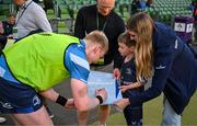 11 April 2025; Leinster mascot Ruadh Roche with Leinster player Jamie Osborne before the Investec Champions Cup quarter-final match between Leinster and Glasgow Warriors at the Aviva Stadium in Dublin. Photo by Brendan Moran/Sportsfile