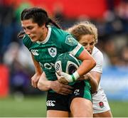 12 April 2025; Amee-Leigh Costigan of Ireland is tackled by Abby Dow of England during the Women's Six Nations Rugby Championship match between Ireland and England at Virgin Media Park in Cork. Photo by Matt Browne/Sportsfile