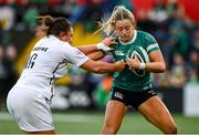 12 April 2025; Stacey Flood of Ireland is tackled by Amy Cokayne of England during the Women's Six Nations Rugby Championship match between Ireland and England at Virgin Media Park in Cork. Photo by Matt Browne/Sportsfile