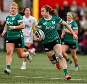 12 April 2025; Eve Higgins of Ireland in action against England during the Women's Six Nations Rugby Championship match between Ireland and England at Virgin Media Park in Cork. Photo by Matt Browne/Sportsfile