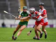 13 April 2025; Grace Teehan of Offaly is tackled by Rachel McAllister of Derry during the Very National Camogie League Division 2A final match between between Derry and Offaly at FBD Semple Stadium in Thurles, Tipperary. Photo by Tom Beary/Sportsfile