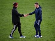13 April 2025; Louth manager Ger Brennan, left, and Laois selector Ross Munnelly shake hands before the Leinster GAA Football Senior Championship quarter-final match between Louth and Laois at Cedral St Conleth's Park in Newbridge, KiIdare. Photo by Piaras Ó Mídheach/Sportsfile