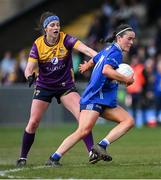 13 April 2025; Lauren McVeety of Cavan is tackled by Róisín Murphy of Wexford during the Lidl Ladies National Football League Division 3 final match between Cavan and Wexford at Integral GAA Grounds in Drogheda, Louth. Photo by Shauna Clinton/Sportsfile