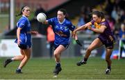 13 April 2025; Sinead Greene of Cavan is tackled by Bebhinn McDonald of Wexford during the Lidl Ladies National Football League Division 3 final match between Cavan and Wexford at Integral GAA Grounds in Drogheda, Louth. Photo by Shauna Clinton/Sportsfile