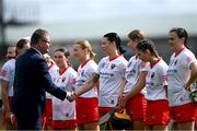 13 April 2025; Uachtarán an Cumann Camógaíochta Brian Molloy shakes hands with Ashling Thompson of Cork before the Very National Camogie League Division 1A final match between between Cork and Galway at FBD Semple Stadium in Thurles, Tipperary. Photo by Tom Beary/Sportsfile
