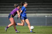 13 April 2025; Catherine Dolan of Cavan kicks a point despite the efforts of Aoife Tormey of Wexford during the Lidl Ladies National Football League Division 3 final match between Cavan and Wexford at Integral GAA Grounds in Drogheda, Louth. Photo by Shauna Clinton/Sportsfile