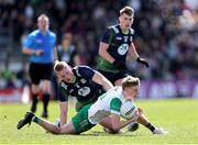 13 April 2025; Daire McDaid of Offaly is tackled by Jack Flynn of Meath during the Leinster GAA Football Senior Championship quarter-final match between Meath and Offaly at Pairc Tailteann in Navan, Meath. Photo by Thomas Flinkow/Sportsfile