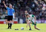 13 April 2025; Daire McDaid of Offaly picks up his boot after being tackled during the Leinster GAA Football Senior Championship quarter-final match between Meath and Offaly at Pairc Tailteann in Navan, Meath. Photo by Thomas Flinkow/Sportsfile