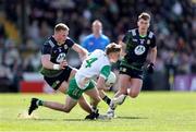 13 April 2025; Daire McDaid of Offaly loses his boot in a tackle by Jack Flynn of Meath during the Leinster GAA Football Senior Championship quarter-final match between Meath and Offaly at Pairc Tailteann in Navan, Meath. Photo by Thomas Flinkow/Sportsfile