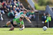 13 April 2025; Meath goalkeeper Billy Hogan is tackled by Daire McDaid of Offaly during the Leinster GAA Football Senior Championship quarter-final match between Meath and Offaly at Pairc Tailteann in Navan, Meath. Photo by Thomas Flinkow/Sportsfile