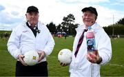 13 April 2025; Umpire Matt Donnellon shows off a bottle of Mi-Wadi alongside Mick Roche before the Lidl Ladies National Football League Division 3 final match between Cavan and Wexford at Integral GAA Grounds in Drogheda, Louth. Photo by Shauna Clinton/Sportsfile