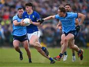 13 April 2025; Jack Kirwan of Wicklow is tackled by Ross McGarry, left, and Peadar Ó Cofaigh Byrne of Dublin during the Leinster GAA Football Senior Championship quarter-final match between Wicklow and Dublin at Echelon Park in Aughrim, Wicklow. Photo by Ray McManus/Sportsfile