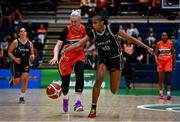 13 April 2025; Robyn Malone of Killester in action against Mathilde Diop of Utility Trust St. Paul's during the Domino's Women's Super League final match between Utility Trust St. Paul's and Killester at the National Basketball Arena in Tallaght, Dublin. Photo by Tyler Miller/Sportsfile