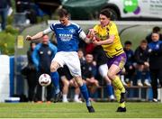 13 April 2025; Vincent Ryan of Limerick District League in action against Reece Murphy of Wexford Football League during the FAI Oscar Traynor Inter-League Cup final match between Limerick District League and Wexford Football League at Jackman Park in Limerick. Photo by Michael P Ryan/Sportsfile