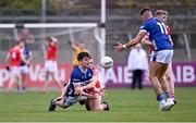 13 April 2025; Ben Dempsey of Laois passes to team-mate Kevin Swayne, 11, under pressure from Andy Mc Donnell of Louth during the Leinster GAA Football Senior Championship quarter-final match between Louth and Laois at Cedral St Conleth's Park in Newbridge, KiIdare. Photo by Piaras Ó Mídheach/Sportsfile