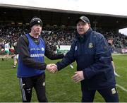 13 April 2025; Offaly joint-manager Declan Kelly, left, with Meath manager Robbie Brennan after the Leinster GAA Football Senior Championship quarter-final match between Meath and Offaly at Pairc Tailteann in Navan, Meath. Photo by Thomas Flinkow/Sportsfile