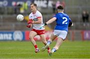 13 April 2025; Kieran McGeary of Tyrone in action against Cian Reilly of Cavan during the Ulster GAA Football Senior Championship quarter-final match between Tyrone and Cavan at O'Neills Healy Park in Omagh, Tyrone. Photo by Ramsey Cardy/Sportsfile