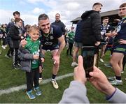 13 April 2025; Bryan Menton of Meath has his photo taken with a supporter after the Leinster GAA Football Senior Championship quarter-final match between Meath and Offaly at Pairc Tailteann in Navan, Meath. Photo by Thomas Flinkow/Sportsfile